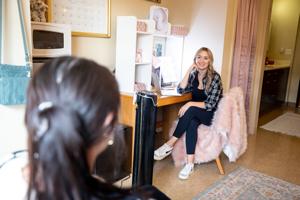 Students talking in a dorm room